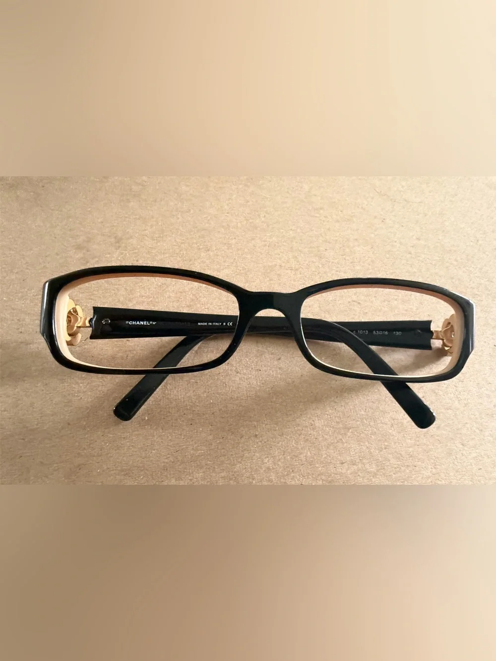 CHANEL Black Frames with Tan Inner Trim and Gold Flower with emblem on temples
